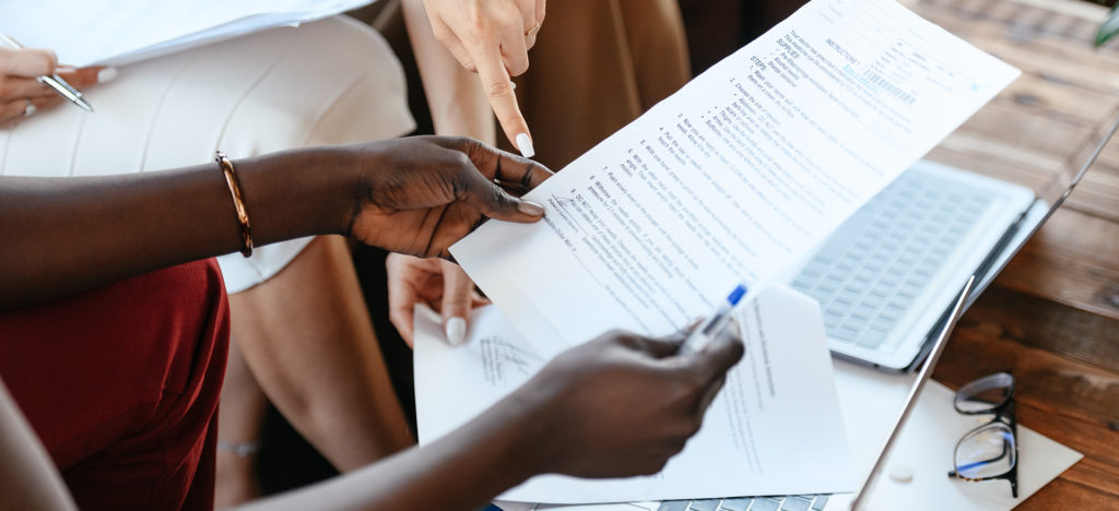 people looking at business document